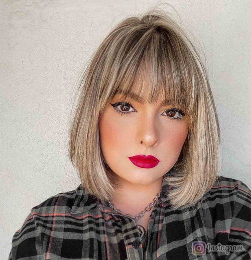 Feathered Bob with Bold Bangs Make a Confident Statement with Layers