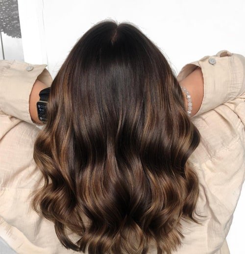 Caramel Brown Waves Warmth and Style in Medium Haircuts